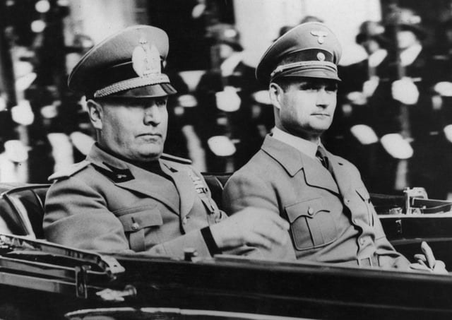 Nazi Party official Rudolf Hess (1894 - 1987, right) in a car with Italian leader Benito Mussolini, circa 1938. (Photo by Keystone/Hulton Archive/Getty Images)