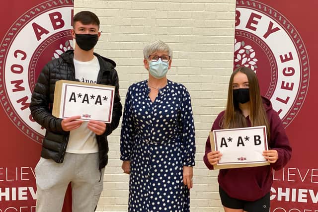 Jonathan Edge (head Boy), Mrs Quinn and Jodie McCord (Head Girl)..
