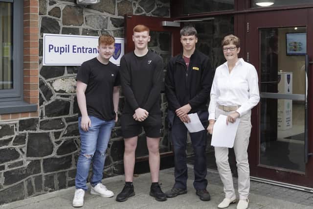 Jack Kirkpatrick (A*A C at GCE A Level), James Henderson (AAA at GCE A Level) and Sam Kyle (AAC at GCE A Level) and Mrs K Bell Principal.