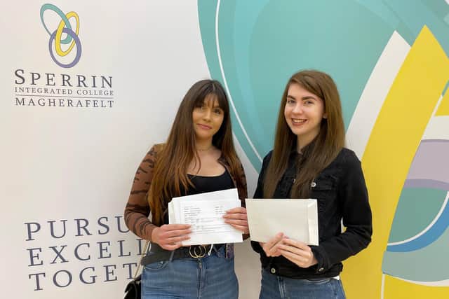 Students Natalia Sulkowska and Lauren McNulty with their exam results.