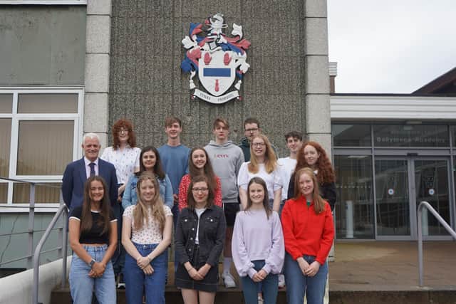 15 pupils attained 3A* grades or higher. They are pictured with principal, Mr S.W. Black