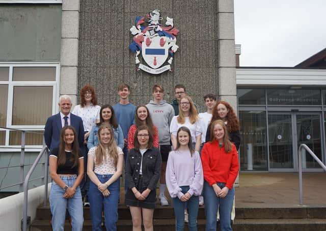15 pupils attained 3A* grades or higher. They are pictured with principal, Mr S.W. Black