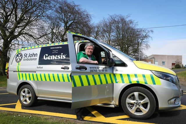 William McCormick, Regional Manager of St John Ambulance (NI), takes delivery of a rapid response vehicle provided by Genesis Bakery.