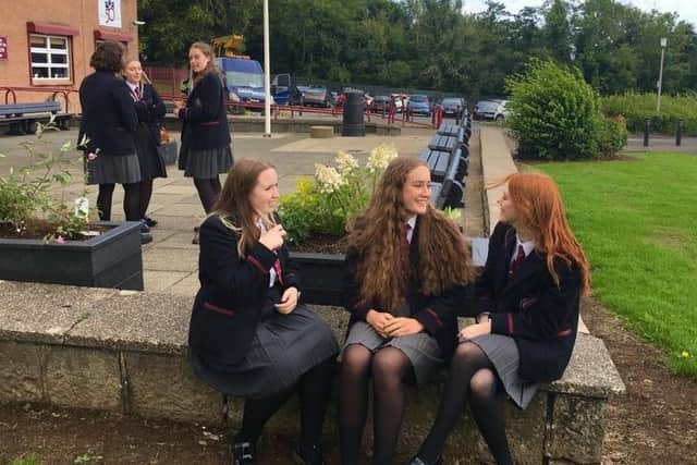 GCSE pupils chatting after picking up their results at Carrickfergus Grammar School on Thursday.