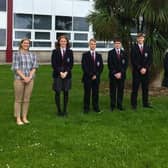 Carrickfergus Grammar School GCSE pupils with nine or more A star grades, included are principal James Maxwell and head of year Mrs Best.