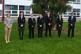 Carrickfergus Grammar School GCSE pupils with nine or more A star grades, included are principal James Maxwell and head of year Mrs Best.