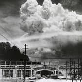 View of the radioactive plume from the bomb dropped on Nagasaki City, as seen from 9.6 km away, in Koyagi-jima, Japan, August 9, 1945. The US B-29 superfortress Bockscar dropped the atomic bomb nicknamed 'Fat Man,' which detonated above the ground, on northern part of Nagasaki City just after 11am. (Photo by Hiromichi Matsuda/Handout from Nagasaki Atomic Bomb Museum/Getty Images)