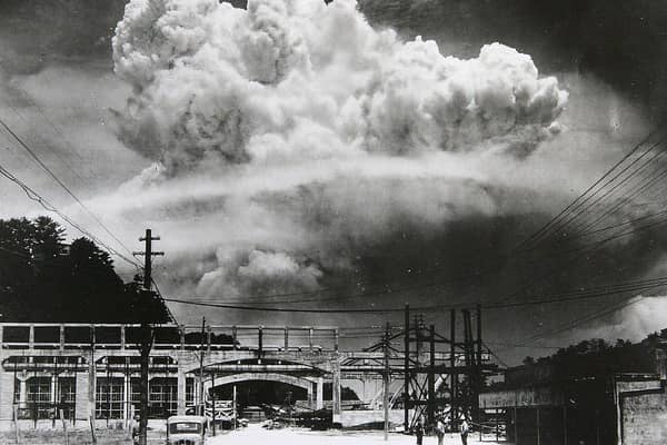 View of the radioactive plume from the bomb dropped on Nagasaki City, as seen from 9.6 km away, in Koyagi-jima, Japan, August 9, 1945. The US B-29 superfortress Bockscar dropped the atomic bomb nicknamed 'Fat Man,' which detonated above the ground, on northern part of Nagasaki City just after 11am. (Photo by Hiromichi Matsuda/Handout from Nagasaki Atomic Bomb Museum/Getty Images)