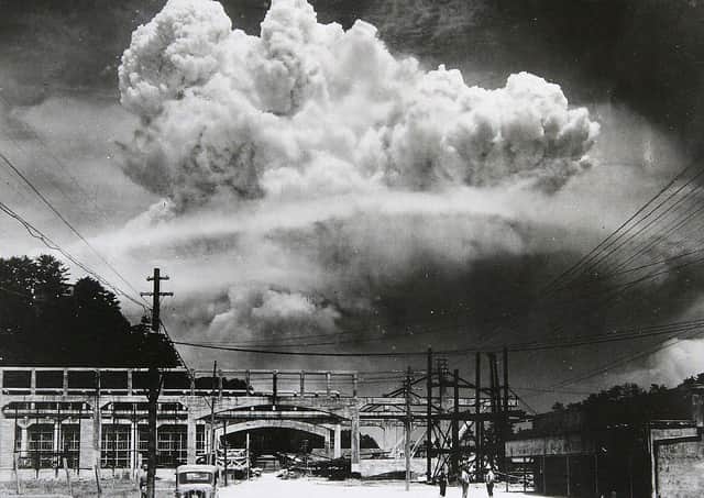 View of the radioactive plume from the bomb dropped on Nagasaki City, as seen from 9.6 km away, in Koyagi-jima, Japan, August 9, 1945. The US B-29 superfortress Bockscar dropped the atomic bomb nicknamed 'Fat Man,' which detonated above the ground, on northern part of Nagasaki City just after 11am. (Photo by Hiromichi Matsuda/Handout from Nagasaki Atomic Bomb Museum/Getty Images)
