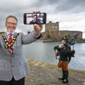 Mayor, Councillor William McCaughey gets ready for the historic concert in September. The Massed Bands of the Army's four Irish Regiments' Carrickfergus Castle performance will be streamed across Mid and East Antrim Borough Council's online platforms.