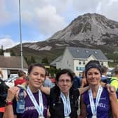 Nicky Frizelle, Adele Tomb & Carolyn Crawford at the finish of the Seven Sisters Sky Challenge