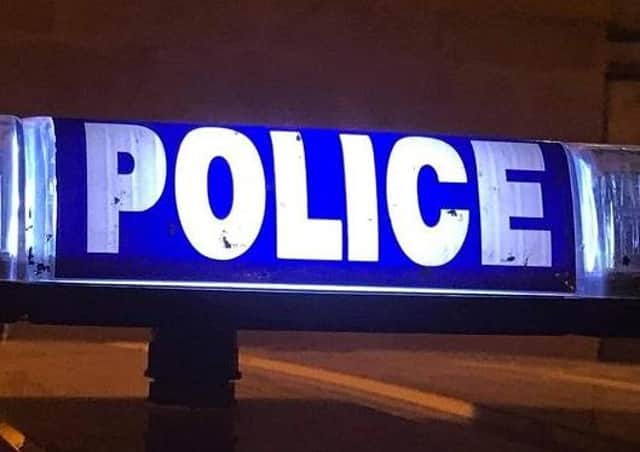 Police are hunting armed robbers who made off with cash from commercial premises in Pomeroy.