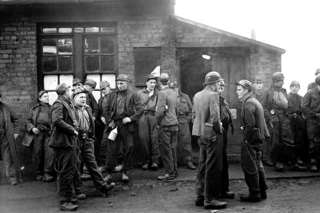 Workers at Whitehaven, Cumbria, where an explosion has trapped miners in the undersea workings of the Lowca No 10 pit in August 1947. Picture: PA