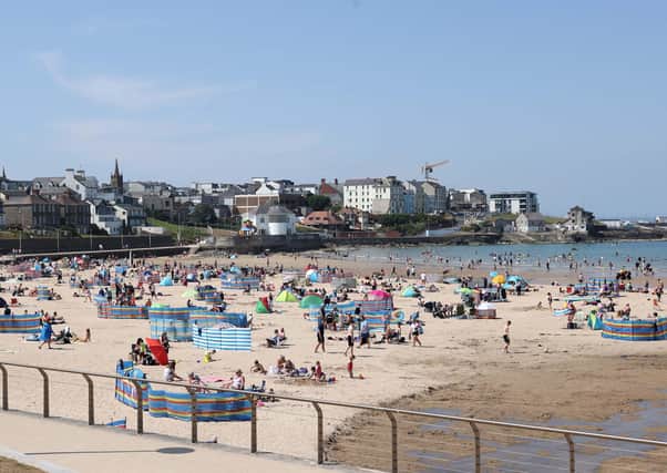 Crowds enjoy the heatwave in Northern Ireland this summer as the record temperature of 31.3c was set. Portrush East Strand. Picture: Steven McAuley/McAuley Multimedia