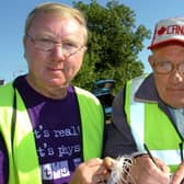 Dennis Bell and Sam Stockman complete the final forms prior to the start of the Mid-Ulster Vintage Vehicle Club’s sponsored two day tractor and car trek from Moneymore to Castlerock and return in aid of ME Research in August 2010. Picture: Simon Robinson/Mid Ulster Mail archives