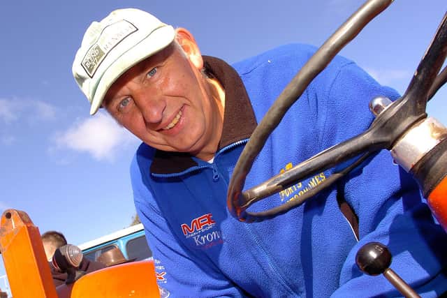 David Wylie completes the final forms prior to the start of the Mid-Ulster Vintage Vehicle Club’s sponsored two day tractor and car trek from Moneymore to Castlerock and return in aid of ME Research in August 2010. Picture: Simon Robinson/Mid Ulster Mail archives