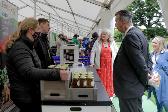 Laura McCorry, Head of Hillsborough Castle welcomes Michele Shirlow of Food NI, and DAERA Minister Edwin Poots MLA, to Hillsborough Castle for the first ever Hillsborough Honey Fair where over 30 local producers and food vendors collaborated with Castle gardeners and foragers to celebrate at things bees and honey. Picture: Philip Magowan/Press Eye