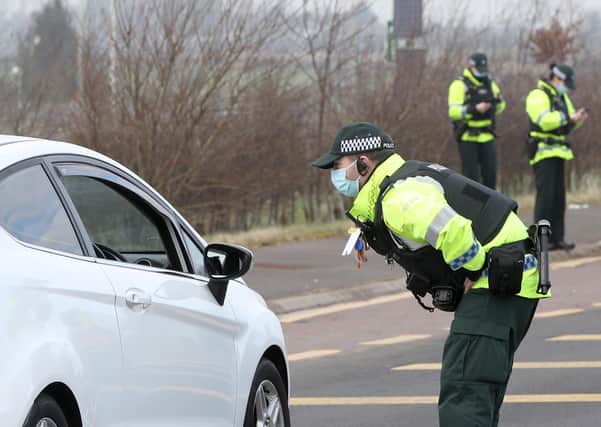 Police check adherence to Covid regulations at check point between Ballymoney and Ballymena ahead of an expected car cruise event in Portrush in February. Photo: Press Eye.
