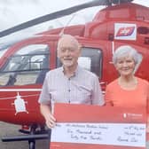 Ronnie and wife Sylvia Orr presenting cheque to Air Ambulance NI