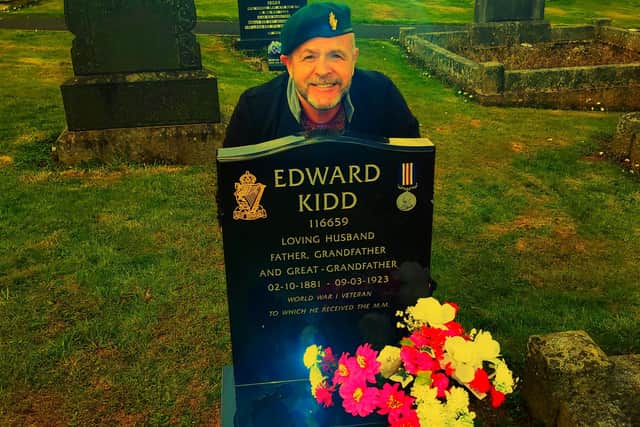 Alastair Kidd pictured at his grandfather's grave.