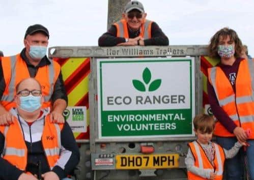 Abe Agnew (centre) and some of his Eco Rangers celebrate receiving new equipment funded from The National Lottery Community Fund.