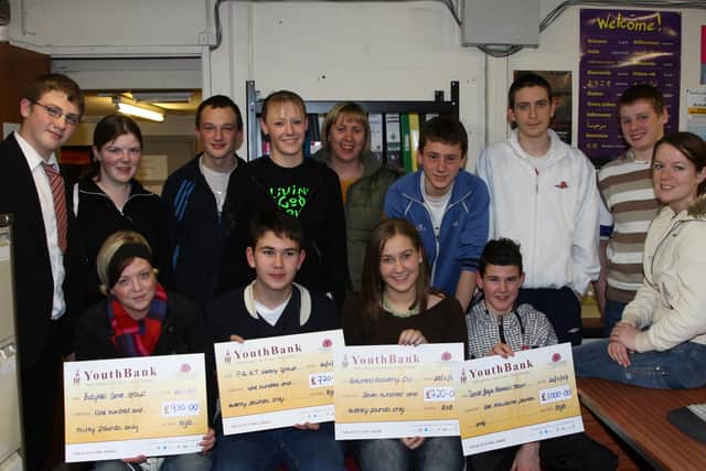 Representitives of local youth groups who received cheques from the Ballymena Youth Bank at an evening at Ballymena Community Forum. Seen here with Youth Bank Co-ordinator Karina Peterson and Youth bank members are Front, L-R, Essen Johnston of the Ballykeel Dance Group, John Waldron of the PAKT Library Group, Rachael Heaney of Ballymena Academy Christian Union and Matthew McGaughey of All Saints YC senior football team. BT48-110JC