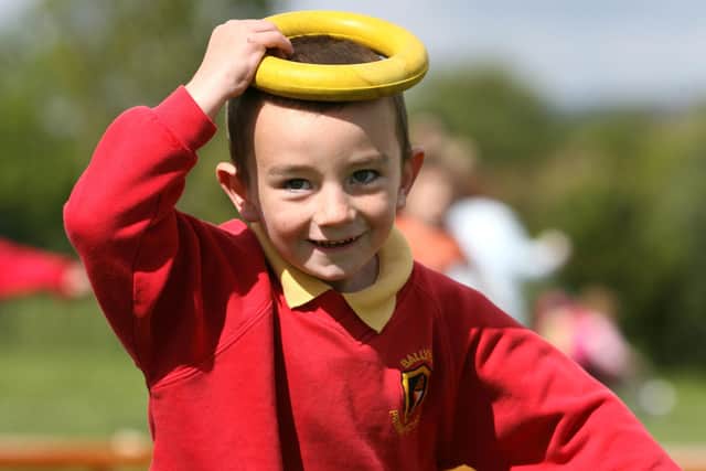 Steady as he goes. Ballykeel Primary School P1 pupil Chad heads for hte line in the boys obstacle race at the school's sports day. BT23-111JC