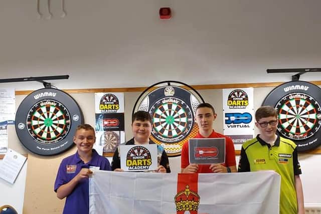 Carrickfergus Junior Darts Academy players Callum Macdougall, Jake Sproule (team captain), Ryan Fowles, and Craig Murtagh. The group will be the very first Northern Ireland team to compete at the JDC Junior Darts Corporation World Cup, and will travel to Gibraltar in November for a full week of competing.