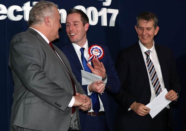 Successful Lagan Valley DUP candidates Paul Givan (centre) and Edwin Poots (right) congratulate Pat Catney of the SDLP on his election to the NI Assembly in 2017. Photograph: Declan Roughan