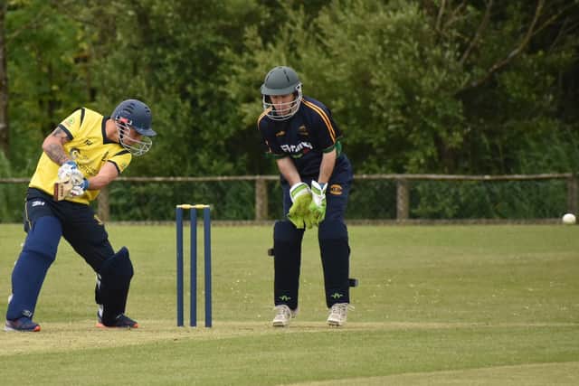 Fox Lodge's Matthew Clarke fires this one away to the boundary.