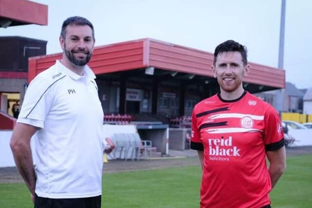 Howard Beverland pictured with Ballyclare Comrades manager, Paul Harbinson.