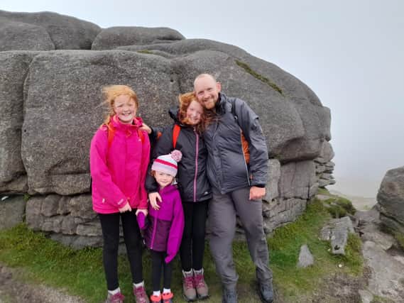 Graeme Warnock is pictured with his daughters, Lydia, Abigail and Joy during their charity climb on Big Binnian