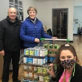 Asda Ballyclare customers donated 2,584 meals to the Newtownabbey Foodbank in a recent food drive. The store's Community Champion Emma Cross is pictured with Foodbank volunteers Dorothy and Ewan McCullough.