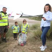 Pictured at White Park Bay are young volunteers Konan and Gaia with Gavin Wallace from North Coast World Earth and Aoife Magennis from Power NI.