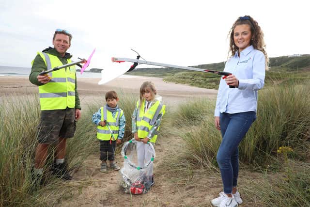 Pictured at White Park Bay are young volunteers Konan and Gaia with Gavin Wallace from North Coast World Earth and Aoife Magennis from Power NI.