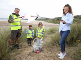 Pictured at White Park Bay are young volunteers Konan and Gaia with Gavin Wallace from North Coast World Earth and Aoife Magennis from Power NI.