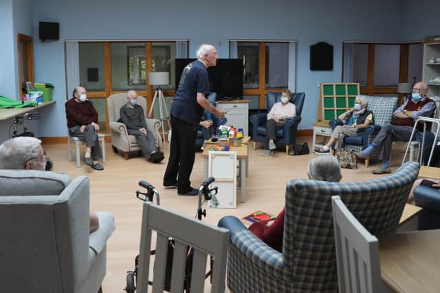 Famed artist Neil Shawcross set up his easel for a masterclass last week much to the delight of Lisburn service users. Picture: Philip Magowan / Press Eye