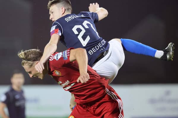 Glenavon captain James Singleton battling for the upper hand in the derby draw with Portadown. Pic by Pacemaker.
