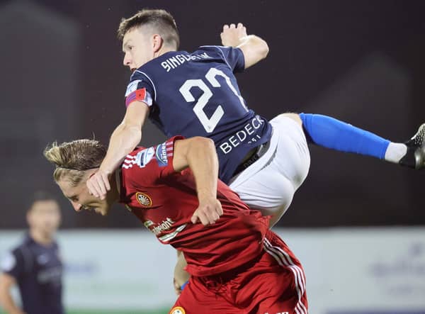 Glenavon captain James Singleton battling for the upper hand in the derby draw with Portadown. Pic by Pacemaker.