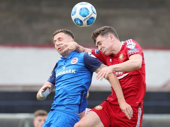 Portadown and Larne battling for control during the Premiership clash at Shamrock Park