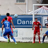Dean Jarvis breaks the deadlock off a Larne corner-kick in Saturday’s clash with Portadown. Pic by Pacemaker.