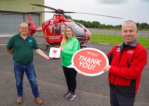 Mark Baillie of MKB Medical and Bronagh Luke from Henderson Group are pictured with the defibrillator they have donated to Air Ambulance NI with Glenn O’Rorke, Operational Lead Paramedic with the Helicopter Emergency Medical Service. The new device will reside outside the organisation’s headquarters on Halftown Road in Lisburn, registered to The Circuit and available 24/7 should it be needed locally
Photo by Aaron McCracken