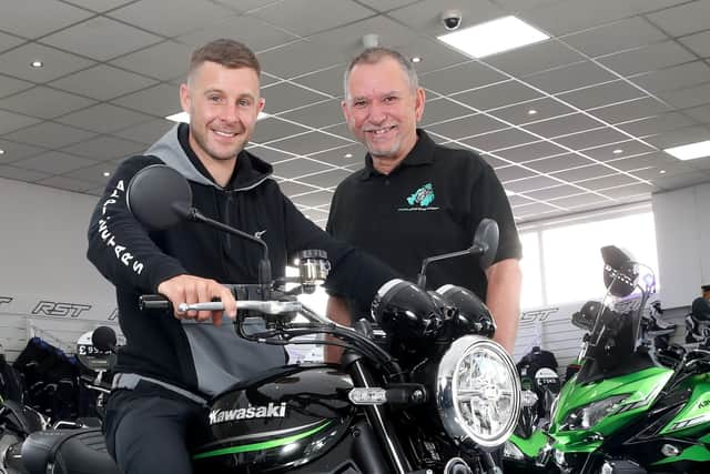 Stephen pictured with Jonathan Rea at the handover of Jonathan's new 
bike