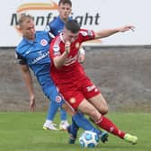 Andrew Mitchell (left) on patrol in the Larne midfield. Pic by PressEye Ltd.