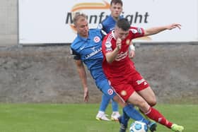 Andrew Mitchell (left) on patrol in the Larne midfield. Pic by PressEye Ltd.