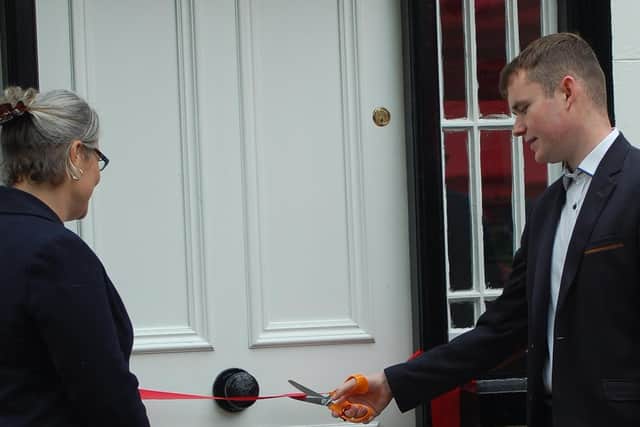 Ms Shannon Austin, New Zealand Deputy High Commissioner to the UK and Jack Ballance Wallace, descendant of Premier John Ballance cutting the ribbon at the front door of The Ballance House