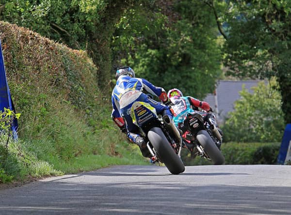 Adam McLean leads Mike Browne in the Open A Superbike race at the Cookstown 100 on Saturday.