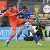 Lee McNulty (left) pictured in action for Carrick Rangers against Coleraine