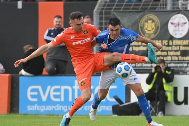 Lee McNulty (left) pictured in action for Carrick Rangers against Coleraine