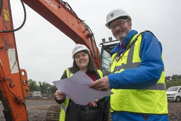 The Mayor of Mid and East Antrim, Cllr William McCaughey and Jessica Stronge, site manager, from CIVCO., look over the plans at Sullatober household recycling cente.